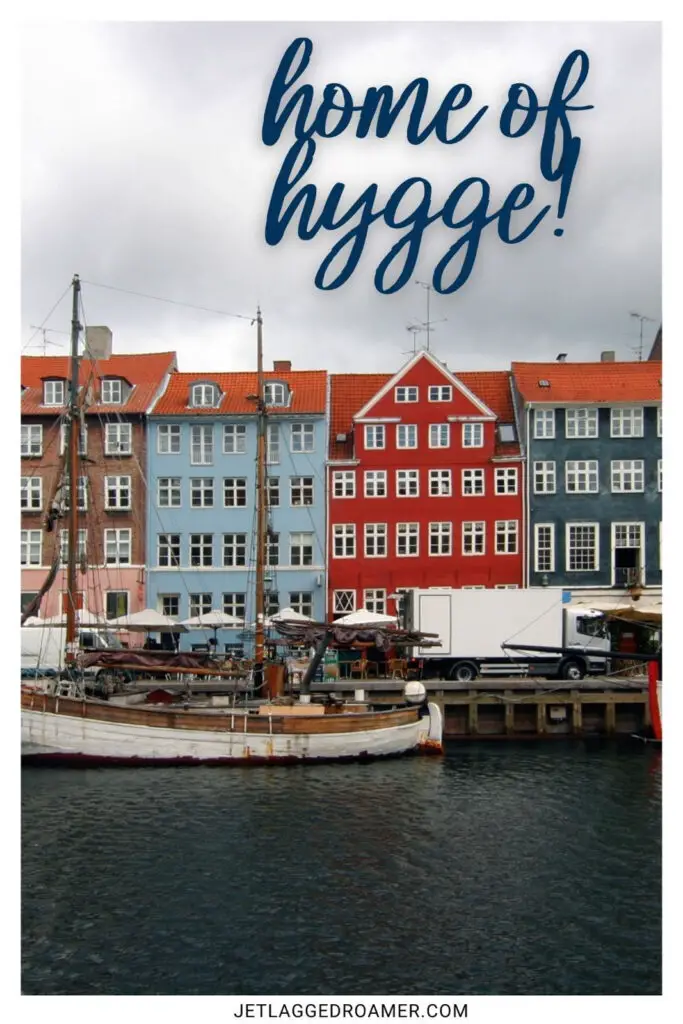 One of the Copenhagen Instagram captions that says "home of hygge." Colorful Nyhavn in Copenhagen, Denmark.