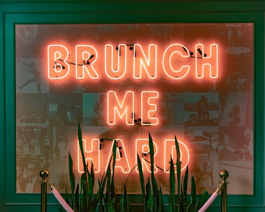 Brunch Me Hard neon sign that says 'Brunch me hard.' Best brunch spot to visit during a weekend in Salt Lake City. 