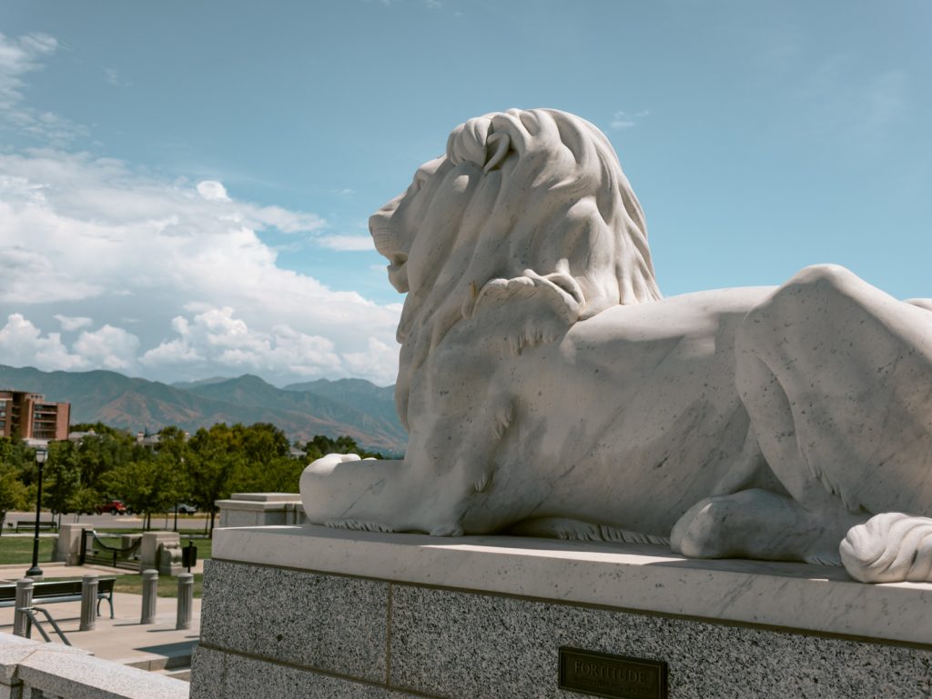 Weekend in Salt Lake City photo of a lion statue outside of the Utah State Capitol. 