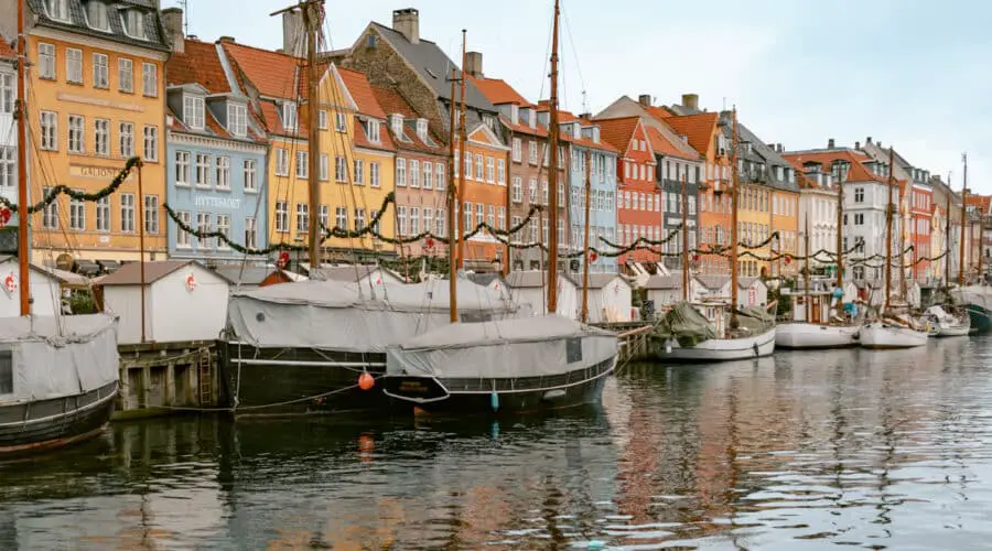 Posing at Nyhavn one of the most Instagrammable places in Copenhagen. One of the top Copenhagen photo spots.