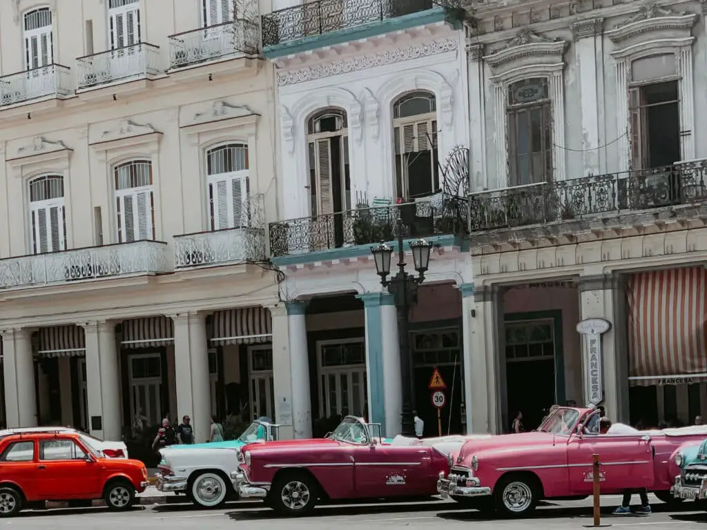 Vintage cars outside of a Havana hotel. 