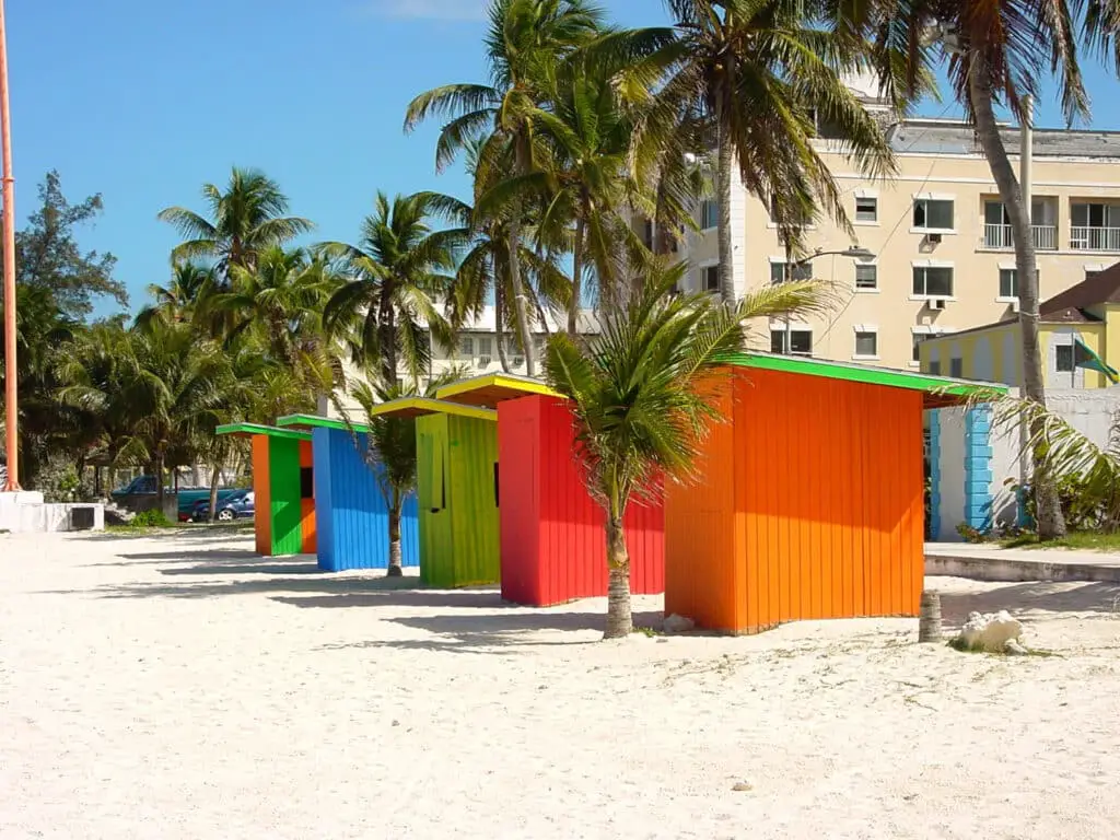 Bahamas captions photo of beach shacks on the beach in the Bahamas. 