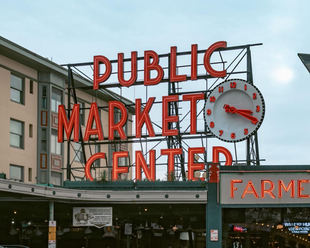 Neon sign that says Public Market Center at Pike Place Market. A must see on any Seattle itinerary.