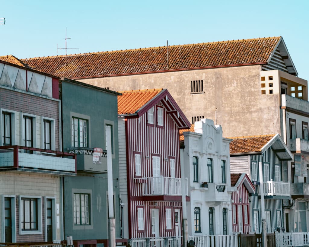 Colorful striped homes in Costa Nova one of the unique day trips from Porto.
