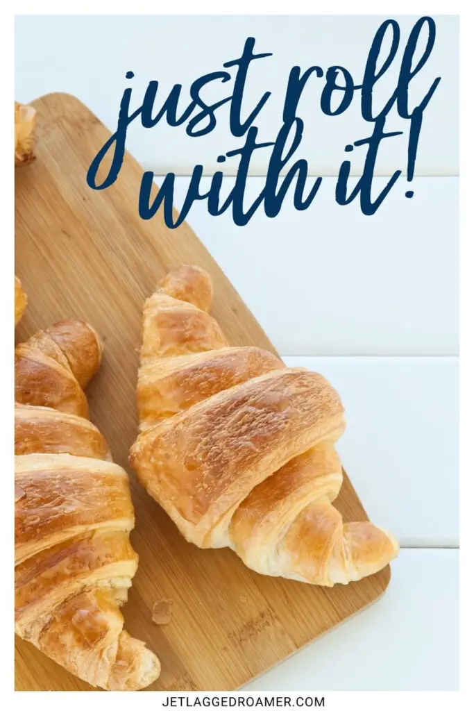 One of the croissant quotes that says just roll with it. Croissants on a cutting board. 