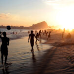 Brazil captions For Instagram photo of locals strolling Copacabana Beach in Rio de Janeiro, Brazil at dusk.