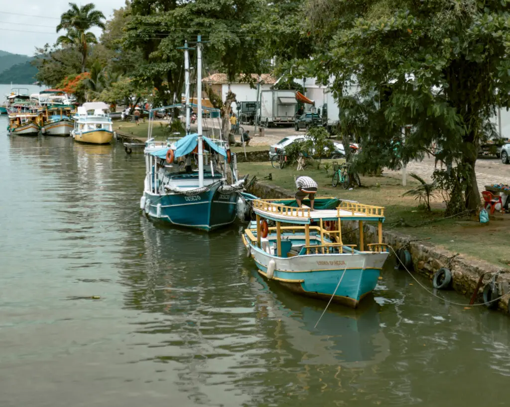 View of colorful fishing boats from Paraty's bridge. 