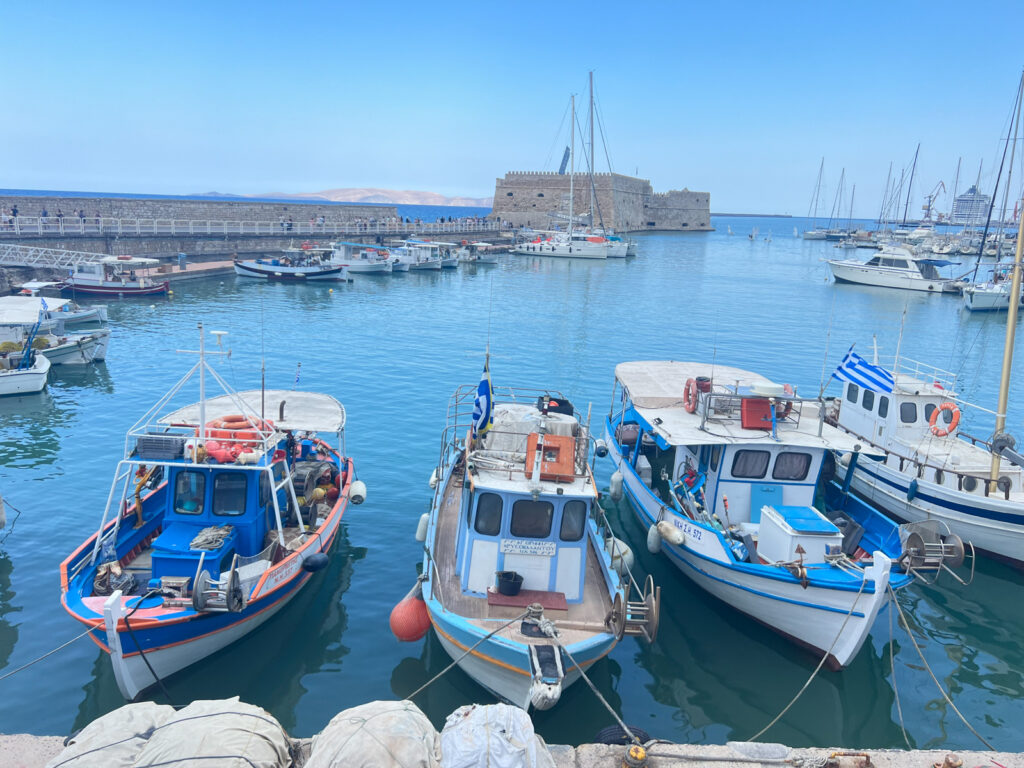 Picturesque boats in Crete one of the best Greek islands to visit when visiting Greece.